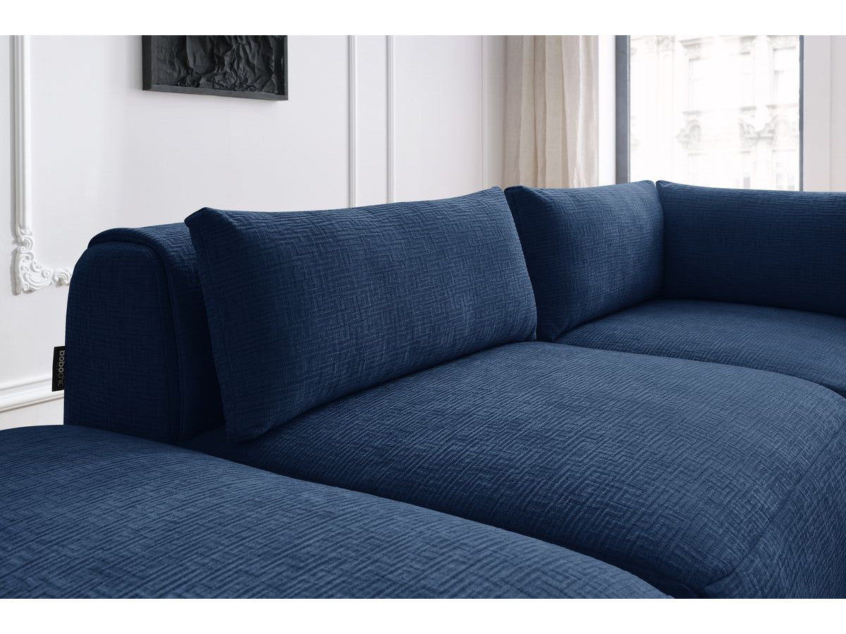 Canapé d'angle fixe modulable JEANNE tissu texturé avec 2 chauffeuses, 1 angle et 2 poufs